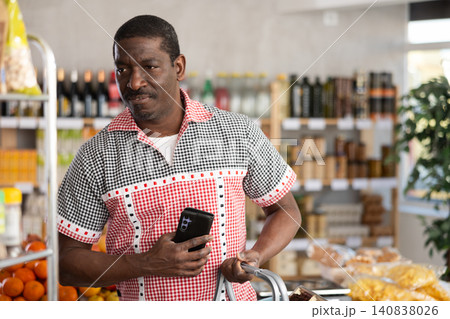 Adult man choosing food in grocery store 140838026