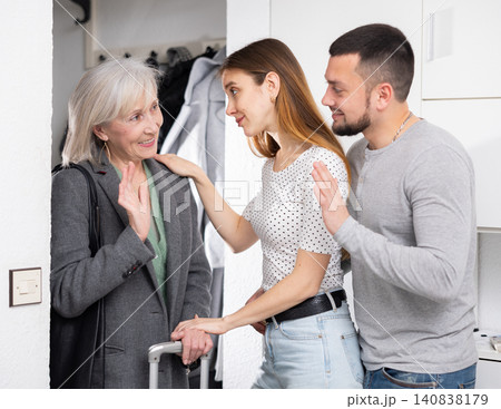 Mother visits her adult children at their home Mother visits her adult children at their home 140838179