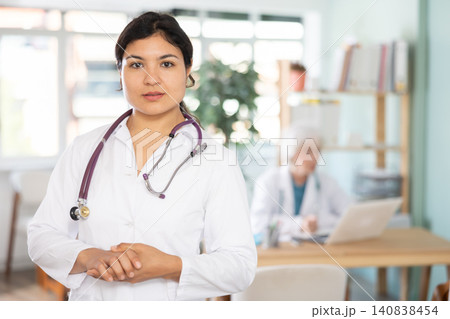 Latin woman doctor before start of appointment working day. Latin woman doctor before start of appointment working day. 140838454