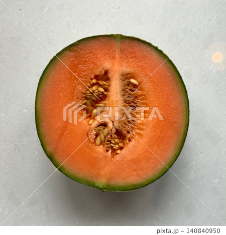Fresh and sweet melon with a vibrant color and juicy, refreshing taste. Perfect for a healthy snack, fruit salads, smoothies, or a cooling summer treat. 140840950