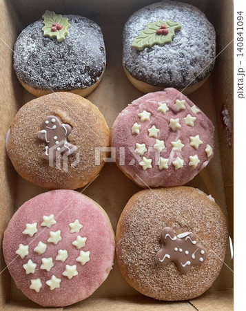 Delicious doughnuts with a golden, fluffy texture, topped with colorful glazes and sprinkles. Perfect for dessert or breakfast photography, showcasing the sweet indulgence of these classic treats. Delicious doughnuts with a golden, fluffy texture, topped with colorful glazes and sprinkles. Perfect for dessert or breakfast photography, showcasing the sweet indulgence of these classic treats. 140841094
