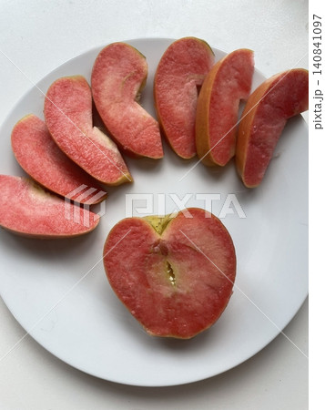 Freshly sliced apple pieces with crisp texture and natural sweetness, beautifully arranged. A healthy and refreshing snack perfect for any time of the day. 140841097