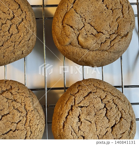 Freshly baked cookies with a golden-brown finish and chocolate chips. Perfectly crisp on the edges with a soft center, offering a delicious, comforting treat for any occasion. 140841131