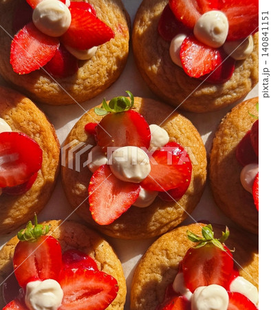 Freshly baked cookies with a golden-brown finish and chocolate chips. Perfectly crisp on the edges with a soft center, offering a delicious, comforting treat for any occasion. 140841151