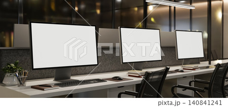 Modern office workspace with multiple desktop computer mockups Modern office workspace with multiple desktop computer mockups 140841241