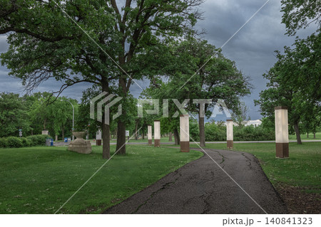Storm Clouds Over Peaceful Park Path Storm Clouds Over Peaceful Park Path 140841323