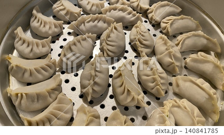 Korean dumplings filled with a mix of savory ingredients like ground meat, tofu, and vegetables. Mandu can be steamed, boiled, or pan-fried, making it a versatile and delicious snack or meal. Korean dumplings filled with a mix of savory ingredients like ground meat, tofu, and vegetables. Mandu can be steamed, boiled, or pan-fried, making it a versatile and delicious snack or meal. 140841785