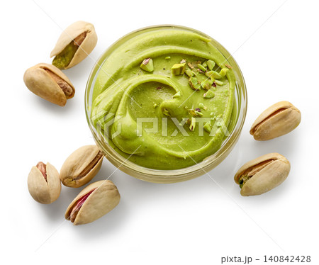 bowl of pistachio spread isolated on white background bowl of pistachio spread isolated on white background 140842428