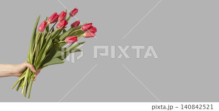 Hand holding garden flowers, tulips bunch, floral bouquet, banner background with copy space. Hand holding garden flowers, tulips bunch, floral bouquet, banner background with copy space. 140842521