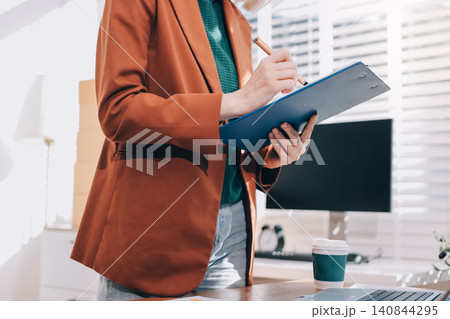 Fashion designer woman and typing on laptop in shop for email project or online order of fabric in creative startup Serious tailor computer and small business for clothes or textile in : Generative AI 140844295