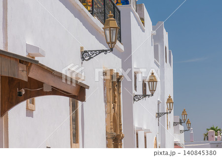 Traditional bronze lanterns decorate the white facades of the Kasbah of the Udayas in Rabat, Morocco. Traditional bronze lanterns decorate the white facades of the Kasbah of the Udayas in Rabat, Morocco. 140845380