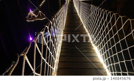Nighttime Suspension Bridge Walkway Illuminating the Path Nighttime Suspension Bridge Walkway Illuminating the Path 140845676