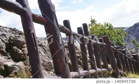 Rustic Fence Against Mountainous Backdrop Landscape Scene Rustic Fence Against Mountainous Backdrop Landscape Scene 140845730