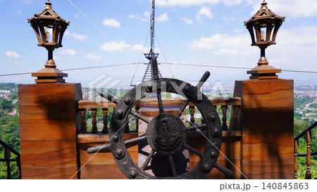 Scenic View from a Ship Replica Ship Wheel and Cityscape Scenic View from a Ship Replica Ship Wheel and Cityscape 140845863