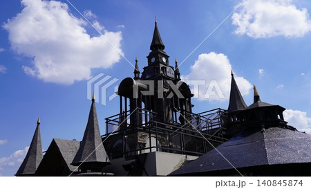 Detailed Clock Tower Under Blue Sky and White Clouds 140845874