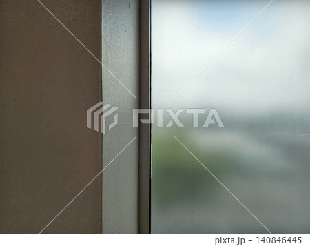 Minimalist Room Corner with Frosted Glass Window, Soft Natural Light Interior Detail for Modern Architectural and Home Decor Backgrounds. 140846445