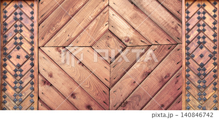Texture of vintage wood board with decorative border with metal rivets. Vertical or horizontal retro background with old wooden plank and aged iron reinforcement. Copy space for text. Mock up template Texture of vintage wood board with decorative border with metal rivets. Vertical or horizontal retro background with old wooden plank and aged iron reinforcement. Copy space for text. Mock up template 140846742