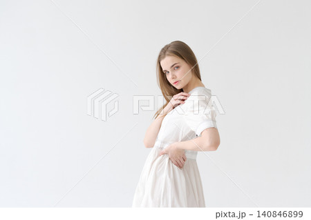 Romantic Young Woman in a White Cotton Dress Soft Feminine Portrait Romantic Young Woman in a White Cotton Dress Soft Feminine Portrait 140846899