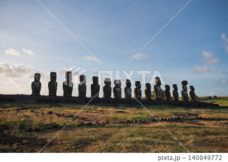 Mysterious monolithic moai statue over green landscape of easter island chile Mysterious monolithic moai statue over green landscape of easter island chile 140849772