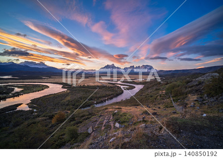 Patagonia mountain river valley at sunset with pink sky Patagonia mountain river valley at sunset with pink sky 140850192