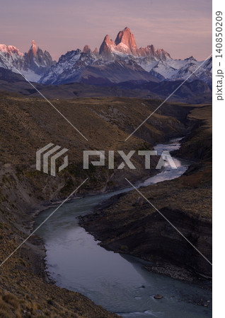 Patagonia mountain valley river at sunrise with pink sky Patagonia mountain valley river at sunrise with pink sky 140850209