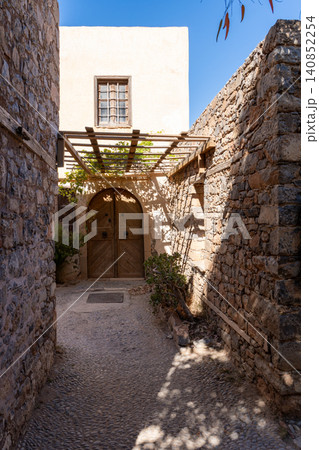 Old Venetian Building with Arched Wooden Door on Spinalonga 140852254