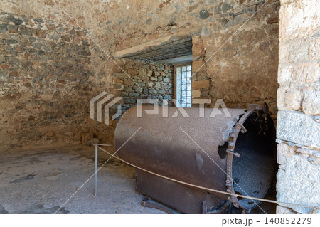 Rusty Machinery Inside Historical Stone Building on Spinalonga Island Rusty Machinery Inside Historical Stone Building on Spinalonga Island 140852279