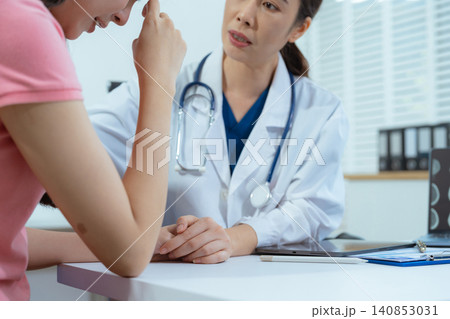 Doctor's hand reassuring woman patient. Doctor's hand reassuring woman patient. 140853031