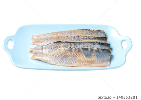 A blue plate with atlantic herring fillet isolated on a white background. A blue plate with atlantic herring fillet isolated on a white background. 140853281