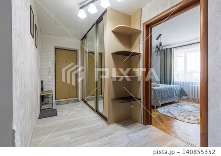 Apartment Hallway Interior with View into Cozy Bedroom Apartment Hallway Interior with View into Cozy Bedroom 140855352