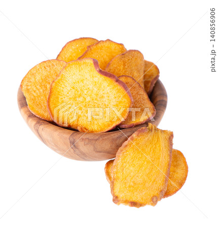 Crispy roasted sweet potato chips with sea salt, isolated on white background. Healthy and crunchy natural vegetable snack. Clipping path. 140856906