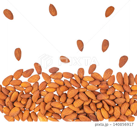 Falling almonds isolated on light background with copy space 140856917