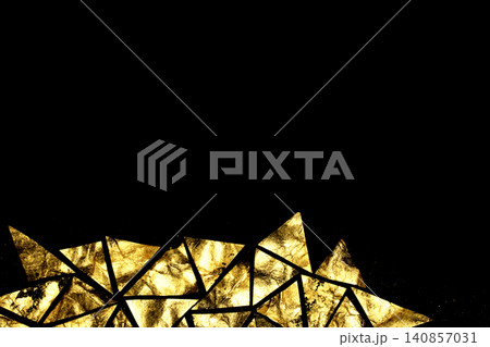Gold metallic geometric triangle paint background on black paper Gold metallic geometric triangle paint background on black paper 140857031