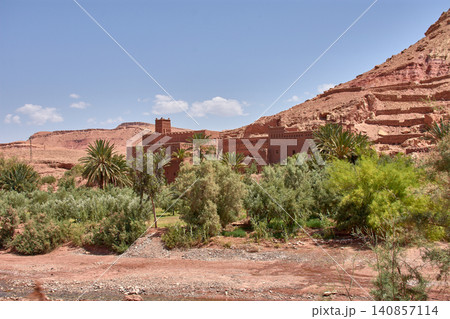 The ancient Ksar of Ait Benhaddou stands majestically beside the Mellah River in southern Morocco. The ancient Ksar of Ait Benhaddou stands majestically beside the Mellah River in southern Morocco. 140857114