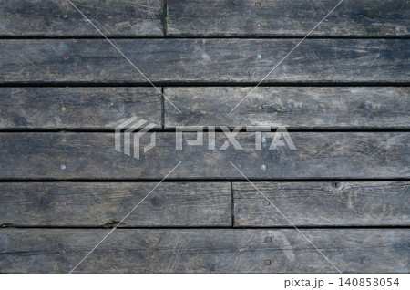 Wooden Floor Texture with Planks Secured by Nails or Screws Wooden Floor Texture with Planks Secured by Nails or Screws 140858054