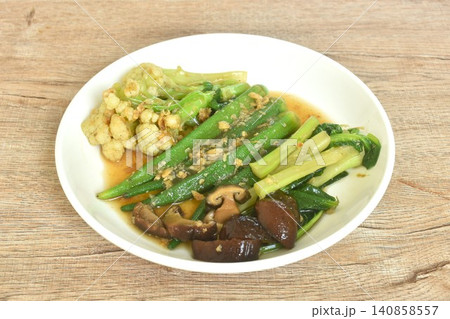stir fried cauliflower and roselle with cabbage topping black mushroom in gravy garlic soy sauce on plate 140858557