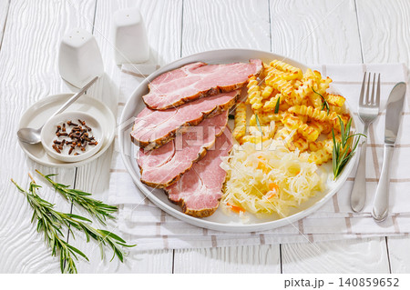 pork neck slices with sour cabbage, french fries 140859652