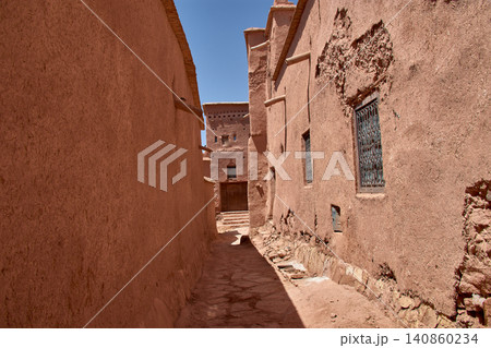 The narrow clay streets reveal the ancient architecture of the Ksar of Ait Benhaddou in southern Morocco. The narrow clay streets reveal the ancient architecture of the Ksar of Ait Benhaddou in southern Morocco. 140860234