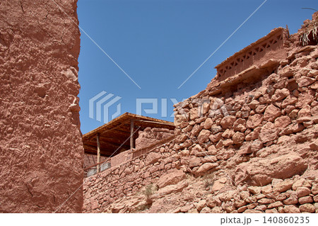 The narrow clay streets reveal the ancient architecture of the Ksar of Ait Benhaddou in southern Morocco. The narrow clay streets reveal the ancient architecture of the Ksar of Ait Benhaddou in southern Morocco. 140860235