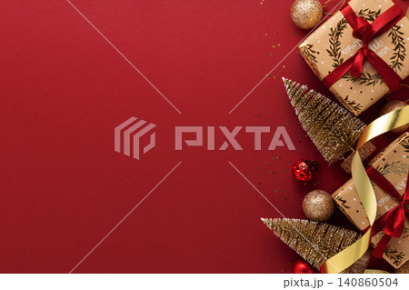 Christmas gifts and decorations forming a festive border 140860504