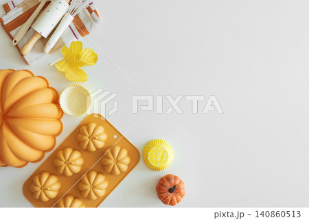 Autumn baking preparation with pumpkin molds and kitchen tools Autumn baking preparation with pumpkin molds and kitchen tools 140860513