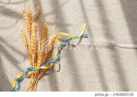 Wheat ears and blue yellow ribbon symbolizing Ukraine Wheat ears and blue yellow ribbon symbolizing Ukraine 140860516