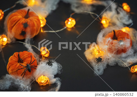 Halloween velvet pumpkins decorating with spooky spiders and lights Halloween velvet pumpkins decorating with spooky spiders and lights 140860532