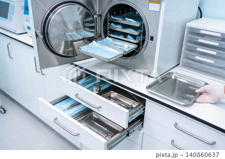Modern sterilization equipment in a medical lab setting for surgical instruments Modern sterilization equipment in a medical lab setting for surgical instruments 140860637