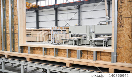Modern factory producing prefabricated wooden wall panels for construction Modern factory producing prefabricated wooden wall panels for construction 140860942