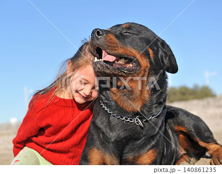 rottweiler and little girl rottweiler and little girl 140861235