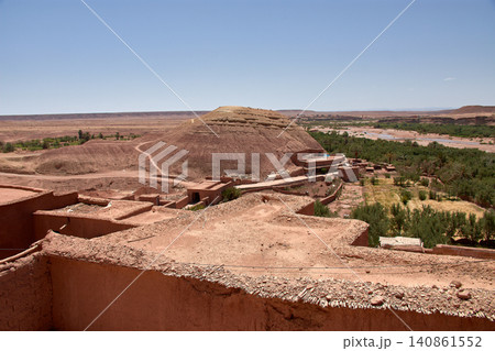 The Ksar of Ait Benhaddou rises majestically above the desert valley of Ouarzazate, Morocco. 140861552
