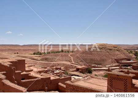 The Ksar of Ait Benhaddou rises majestically above the desert valley of Ouarzazate, Morocco. 140861556