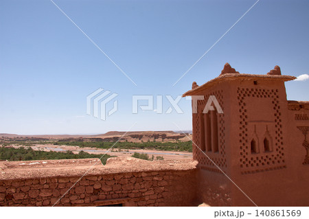 The Ksar of Ait Benhaddou rises majestically above the desert valley of Ouarzazate, Morocco. 140861569