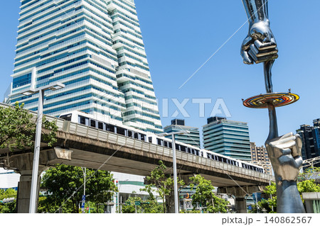 A train on the Wenhu or Brown Line of the Taipei MRT passes by the modern metropolis building in Nangang Software Park Area. A train on the Wenhu or Brown Line of the Taipei MRT passes by the modern metropolis building in Nangang Software Park Area. 140862567